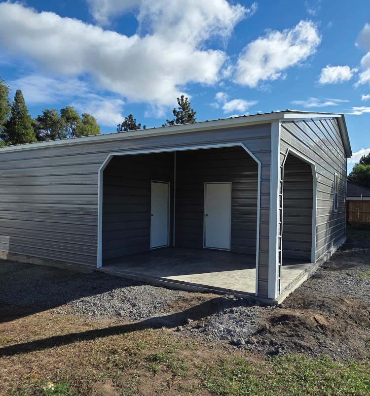 Customized two-story agricultural metal buildings barn with multiple bay doors and a full-span clear interior space for farm equipment.