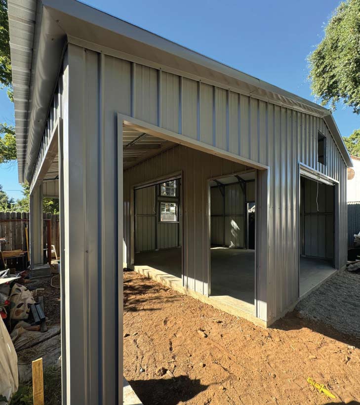 Stunning white and black two-bay fully enclosed 30x51x16 metal carports garage with reinforced bows for maximum structural integrity.