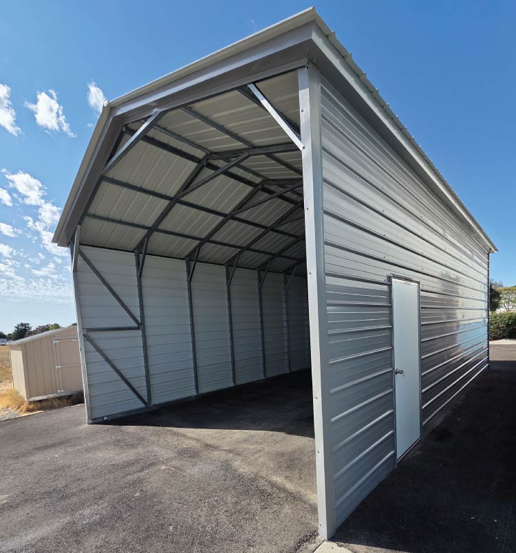 Heavy-duty triple-wide metal RV covers with a vertical roof, providing essential shade and year-round protection for motorhomes.