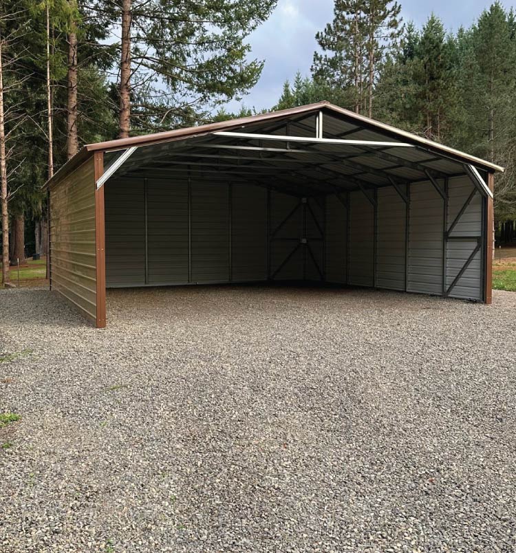 Custom-built 14-foot tall and 40-foot long metal RV covers installed on concrete, certified for high wind zones in Southern California.